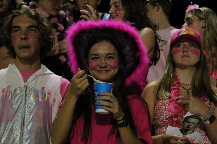 Senior Grace Matthews eating a snow cone during halftime.