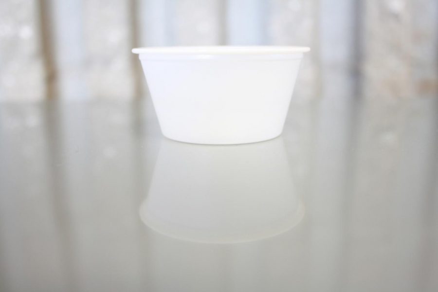 A side cup used for lunch fruits or vegetables.