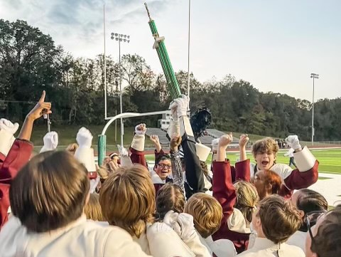 The St. Charles West marching band winning a trophy on their last competition.
