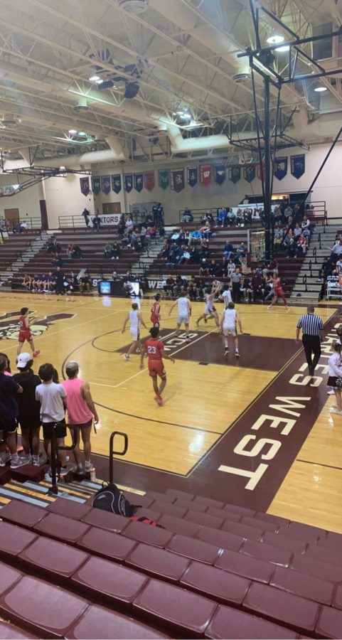The varsity mens basketball team against Winfield during the first quarter.
