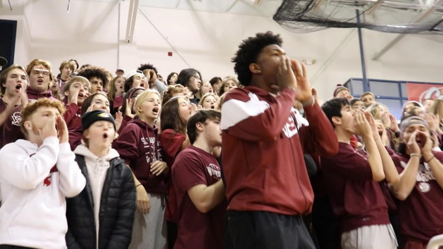 A Maroon Monsoon cheering on our Varsity Basketball at the annual Turkey Tip-off 