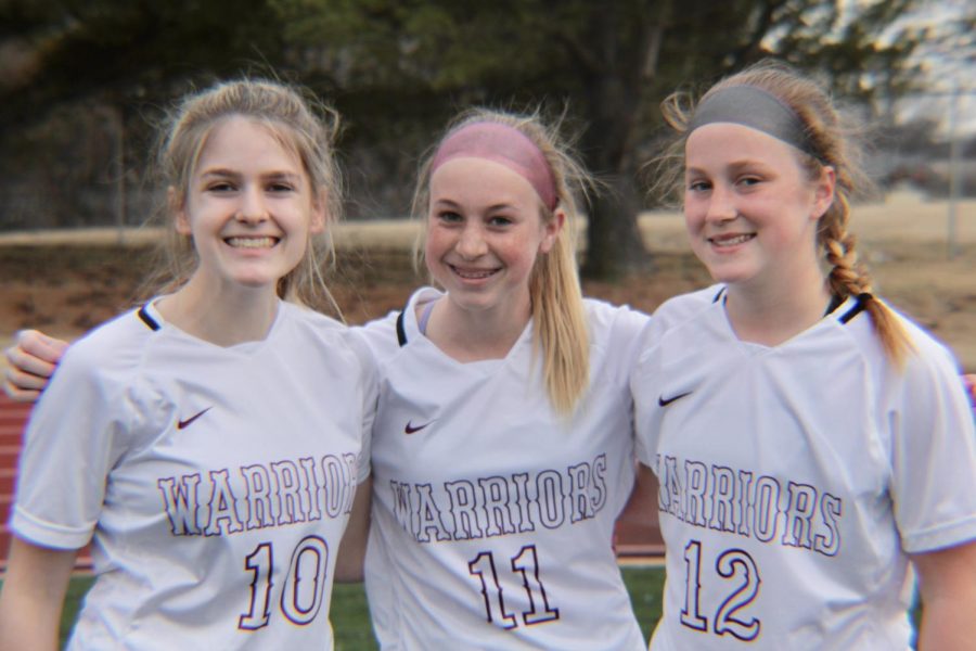 From left to right: Riley McGuire, Genna Wacker, and Anna White during the soccer jamboree.