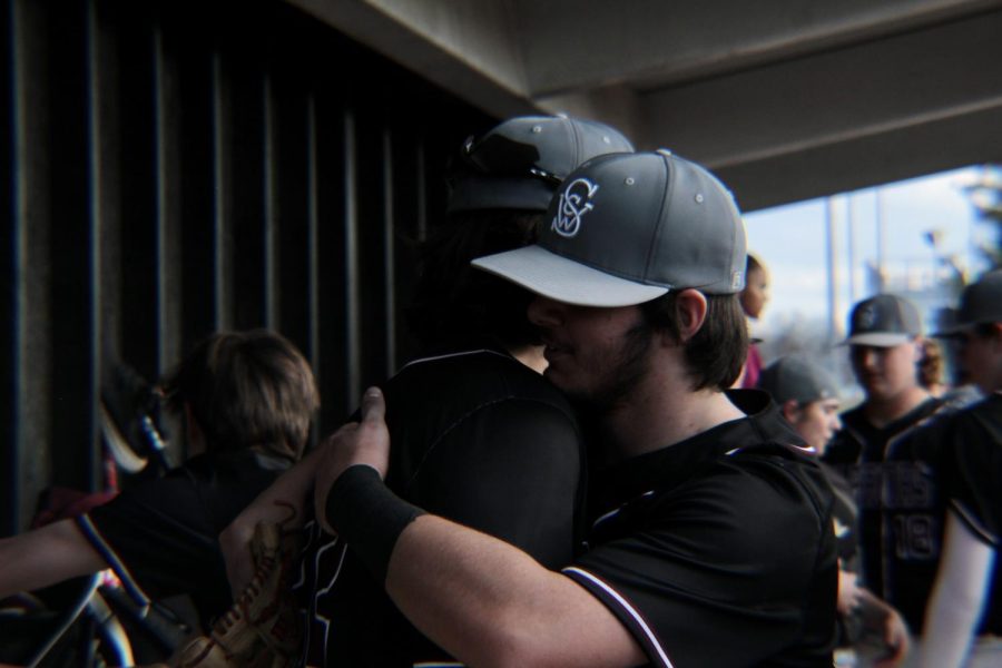 Freshman+Brenan+Goering+and+senior+Dylan+Patterson+hugging+at+the+baseball+jamboree.