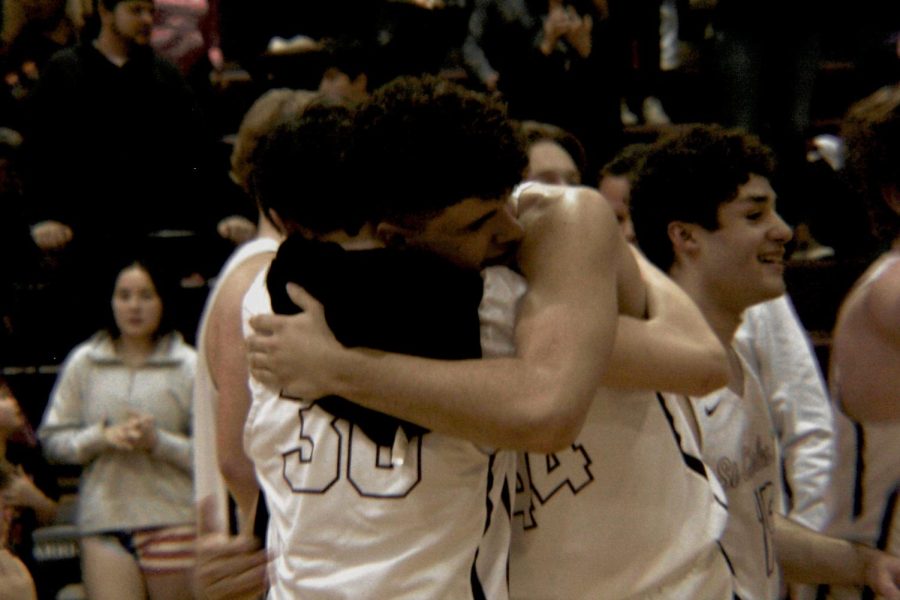 Senior Darin Gordon hugging sophomore Eli Chowning.