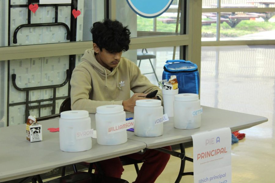 Junior Krish Mehta working the Pie-A-Principal fundraiser on April 26th for NHS Philantrophy Week.