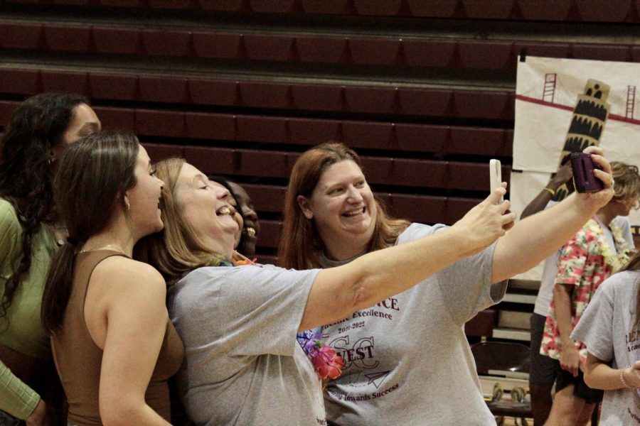 Mrs. Weil and Mrs. Hockmeyer taking selfies with students.