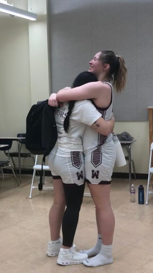Seniors Kameryn Arnold (left) and Elena Scheve (right) hugging after the game on February 10th, 2023.